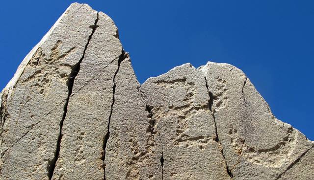 Fig. 4. Sun, swastika and crescent moon situated on top of a naturally occurring pillar of rock, northwestern Tibet. Iron Age or Protohistoric period.