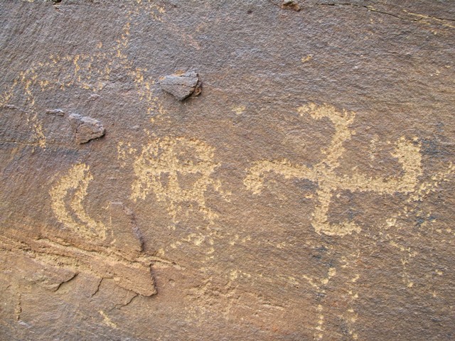 Fig. 6. Crescent moon, sun and swastika, western Tibet. In addition to having a few rays, the sun is divided by a cross into quarters. Protohistoric period.