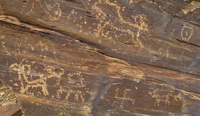 Fig. 25. Swastika and animals, western Tibet. Here again we see figures belonging to a decadent phase in rock art. Early Historic period.