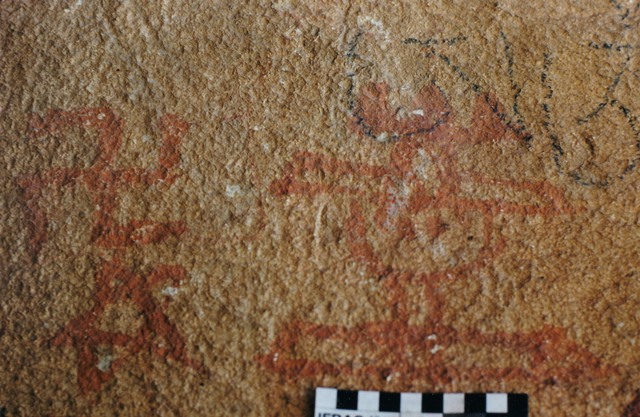 Fig. 39. Red ochre shrine with wide base, narrow stem, rounded vase, wide entablature, and tricuspidate finial, accompanied by five-pointed star and counterclockwise swastika, eastern Changthang, Early Historic period.