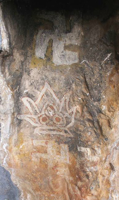 Fig. 46. Polychrome depiction of the flaming jewels (nor bu me ’bar), three counterclockwise swastikas and the mystic letter A (lowermost pigment application), eastern Changthang. Painted circa 700 to 1200 CE. Polychrome pictographs are uncommon in Upper Tibet. The blue-gray background is particularly rare.