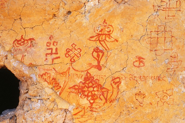 Fig. 55. Other figures painted on the hermitage in figs. 53 and 54, including Yungdrung Bon versions of the Eight Auspicious Symbols (Bkra shis rtags brgyad). Post-11th century CE. The mantra is for the god Shenlha Ödkar.