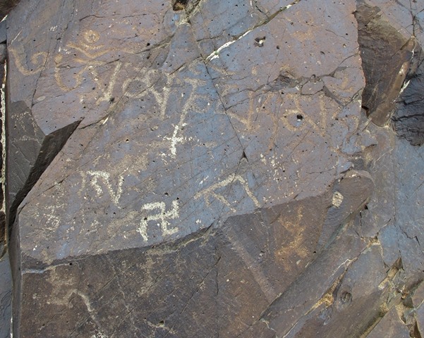 Fig. 59. A mani mantra of the post-Imperial period (850–1000 CE) or perhaps somewhat later, central Changthang. Also on the same rock face are more recently carved swastikas (clockwise and counterclockwise) and other Tibetan lettering.