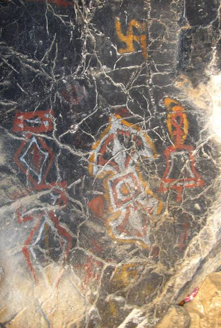 Fig. 63. Polychrome rock art consisting of clockwise swastika, ritual dagger (phur pa), ritual thunderbolt and bell (dril bu). Central Changthang. Probably Vestigial period.