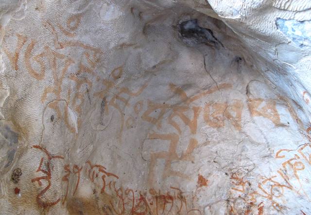 Fig. 68. A counterclockwise swastika painted along with a mantra, reading bso A pha. The mantra and swastika were made by practitioners of bon traditions in the eastern Changthang. It appears to extol a sage, doctrine or people referred to as ‘father’ (A pha). Vestigial period. The mantra to the left reads Om’ hum ram dza /. Its popular Yungdrung Bon counterpart is Om A hum ram dza. The darker red inscription on the lower left side of the image dates to the Imperial period and has been dealt with in my book Zhang Zhung. On the lower right side of the photo is a mani mantra (partially visible).