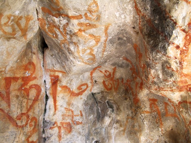 Fig. 72. A counterclockwise swastika amid mantras, Buddhist and non-Buddhist, eastern Changthang. Vestigial period. In this period the rise of Buddhism in Upper Tibet came to overshadow what remained of archaic and alternative religious traditions.