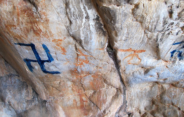 Fig. 84. Recently painted counterclockwise swastika obscuring earlier rock art, eastern Changthang.