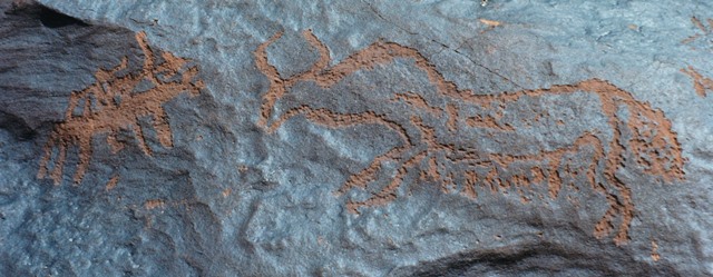 Fig. 11. An archer on horseback pointing his bow and arrow at a charging wild yak, western Changthang. Iron Age.