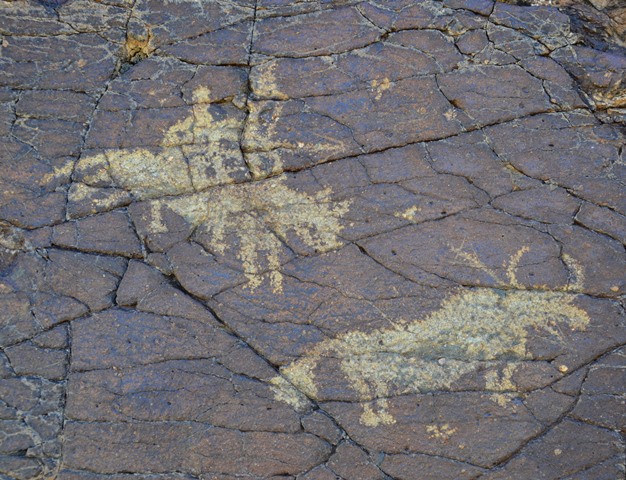 Fig. 35. Hunter approaching wild yak from the side while firing an arrow, western Tibet. Protohistoric period.