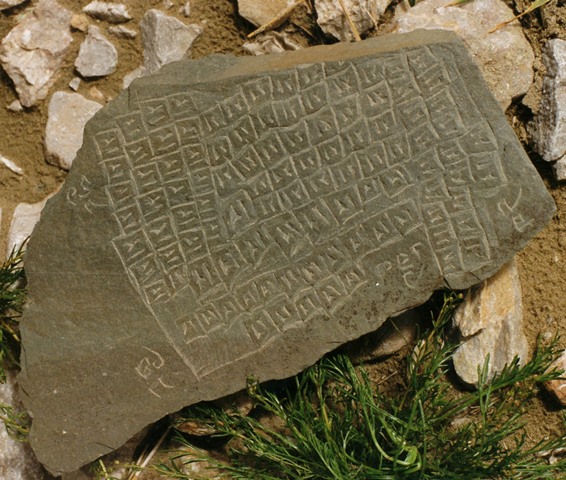 Fig. 5. A stone plaque featuring the 108 kha syllables and the names of the four warrior spirits, complete with spelling mistakes. The mantra of 14 syllables is not included on this plaque. Tshochen/Gertse.