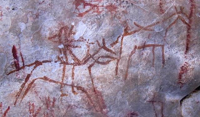 Fig. 21: A hunter on horseback shooting an arrow at an animal resembling a Tibetan wild ass (kyang). Iron Age.