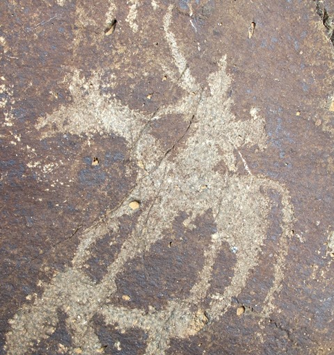 Fig. 24: Figure on horse brandishing a bow with what may be a quiver on his back. Protohistoric period.