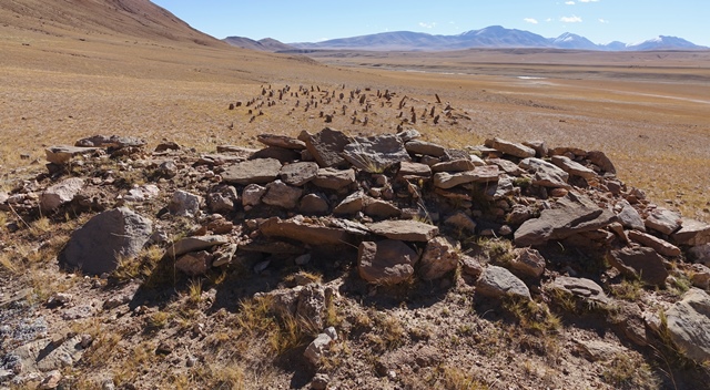 Fig. 10. The array of stelae and appended temple-tomb of the West Complex from the west. The view to the east is the most profound at the site.