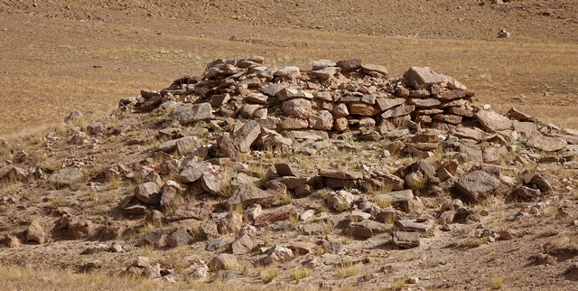 Fig. 12. The south side of the temple-tomb, West Complex. Note the coherent wall segment composed of both blocks and slabs of stone. Below the edifice are two vertical courses of masonry that appear to be vestiges of a plinth or retaining wall.