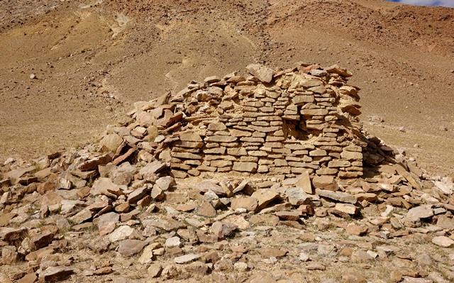 Fig. 34. The south wall of the temple-tomb, Central Complex. Note how this standing wall is primarily constructed of slabs.