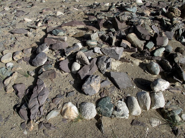 Fig. 37. Traces of coherent wall footings on the north corner of Mound II. These kinds of footings typically underpinned freestanding masonry walls.