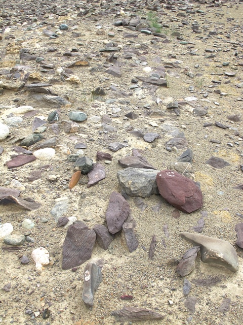 Fig. 40. A coherent wall footing on the northwest side of Mound III. This double-course footing (60–70 cm thick) would have supported a freestanding wall, suggesting that a significant masonry edifice once stood here.