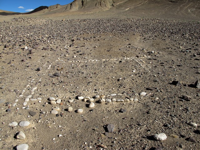 Fig. 42. Single-course walls and double-course cobble wall enclosure pictured in fig. 41, as seen from the southeast. Note how the east corner of the double-course enclosure is absent. The tumulus in the upper left corner of the image is Mound II.