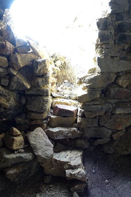 Fig. 16. Entrance and façade of cave on edge of the bench seen from the interior.