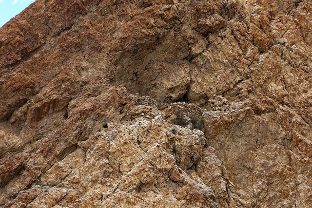 Fig. 18. Ruined wall of rock shelter perched in the orange formation directly above the bench at Gondak.