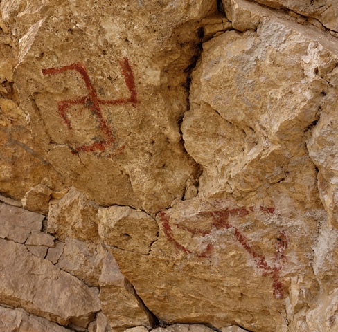 Fig. 31. A close-up of the letter A and swastika on the wall of the formation.