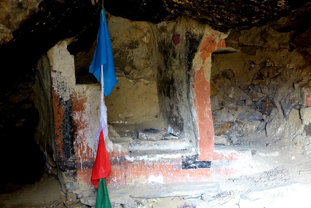 Fig. 40. A stone and adobe ambry in rear of the larger cave of the middle tier, upper residential complex. This structure was painted with three different colored pigments. To the right is an alcove.