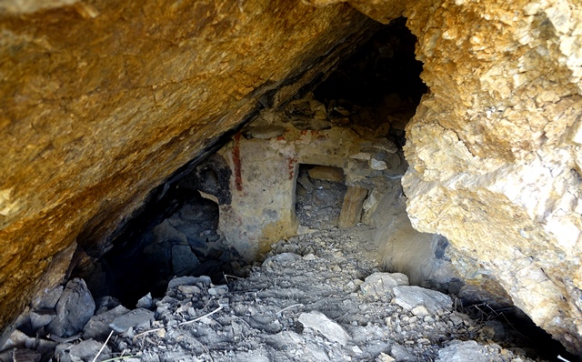 Fig. 42. Smaller cave of middle tier with wall partitioning it into forward and rear chambers. Note the red, beige and white pigments used to paint the partition.
