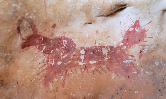 Fig. 137. Lone wild yak Prominent motifs: barbed tail; circular horns; anterior hump; square snout, long neck; arched belly, hairy fringe; two barbed, V-shaped legs Body: silhouetted Technique: painted, red ochre Region: Eastern Changthang Estimated Age: Protohistoric period or Early Historic period